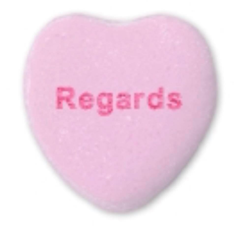 Candy heart with the word Regards printed in red.